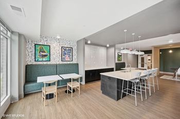 a kitchen and dining area with a table and chairs